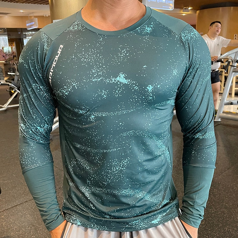 Men's Long Sleeve Gym Shirt, Sportswear Compression with Dry Fit Technology. Designed for Fitness and Sports, this Tight-Fitting T-Shirt keeps you Comfortable and Dry during Intense Workouts.