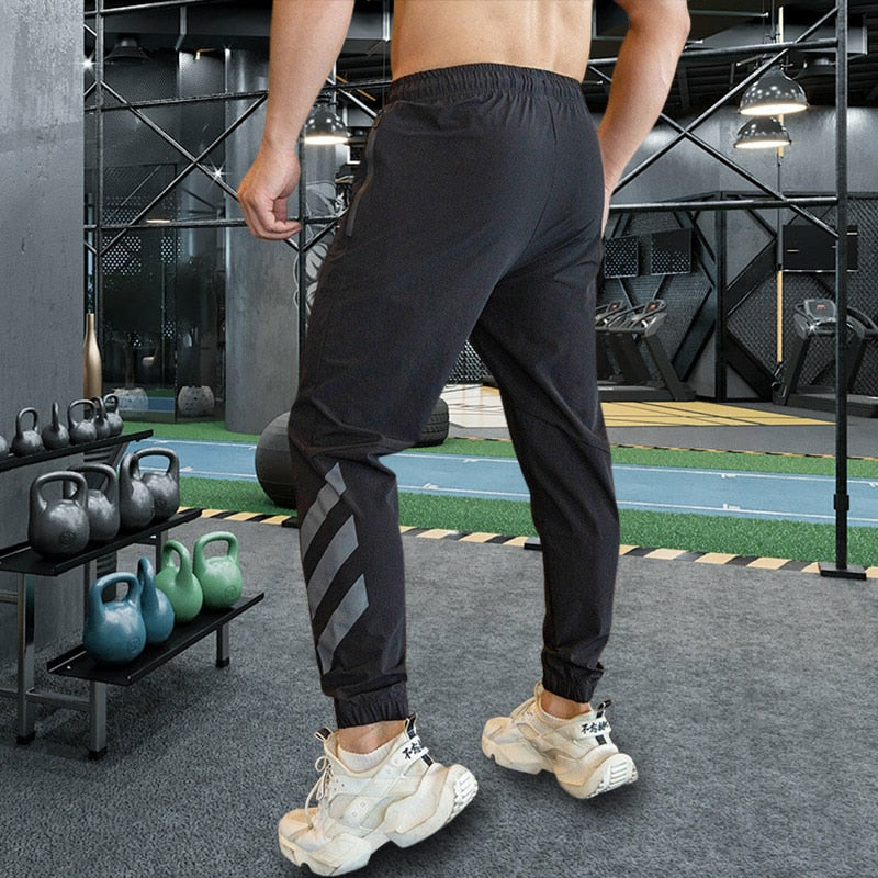 Mens Gym Fitness Running Sweatpants Workout Athletic Long Pants Outdoor Training Sports Trousers Elastic Waist Zipper Pockets