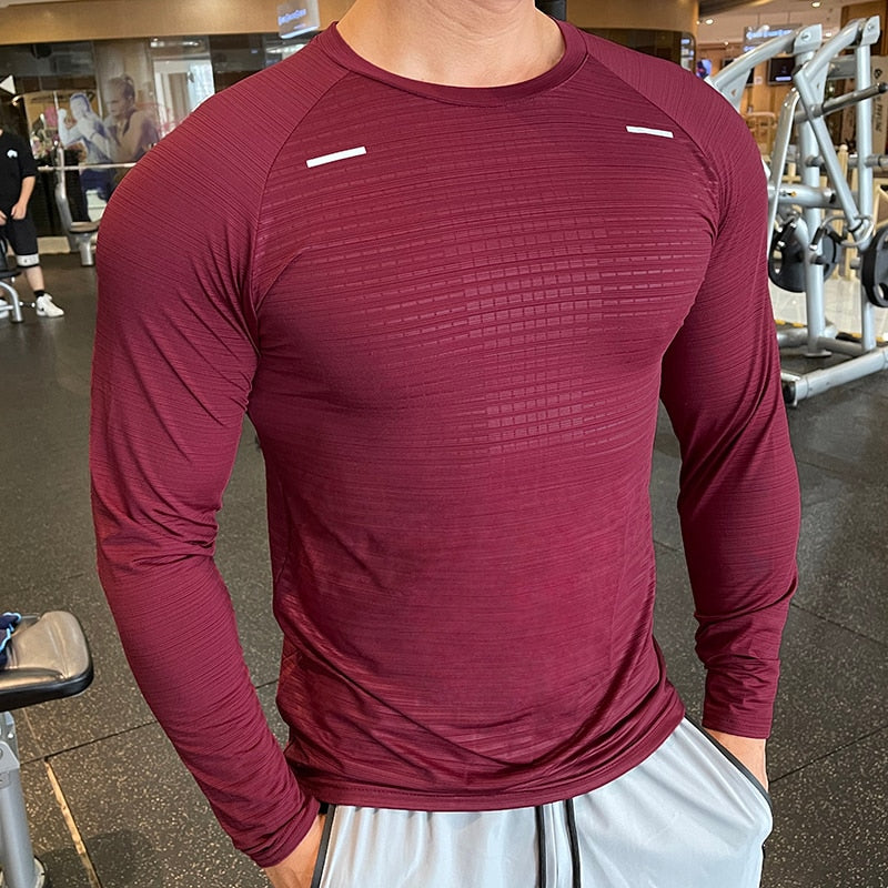 Men's Long Sleeve Gym Shirt, Sportswear Compression with Dry Fit Technology. Designed for Fitness and Sports, this Tight-Fitting T-Shirt keeps you Comfortable and Dry during Intense Workouts.