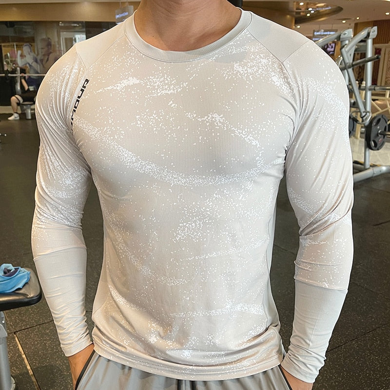 Men's Long Sleeve Gym Shirt, Sportswear Compression with Dry Fit Technology. Designed for Fitness and Sports, this Tight-Fitting T-Shirt keeps you Comfortable and Dry during Intense Workouts.