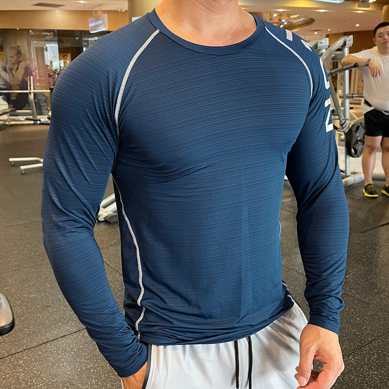 Men's Long Sleeve Gym Shirt, Sportswear Compression with Dry Fit Technology. Designed for Fitness and Sports, this Tight-Fitting T-Shirt keeps you Comfortable and Dry during Intense Workouts.