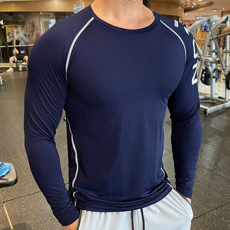 Men's Long Sleeve Gym Shirt, Sportswear Compression with Dry Fit Technology. Designed for Fitness and Sports, this Tight-Fitting T-Shirt keeps you Comfortable and Dry during Intense Workouts.