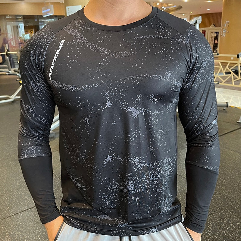 Men's Long Sleeve Gym Shirt, Sportswear Compression with Dry Fit Technology. Designed for Fitness and Sports, this Tight-Fitting T-Shirt keeps you Comfortable and Dry during Intense Workouts.