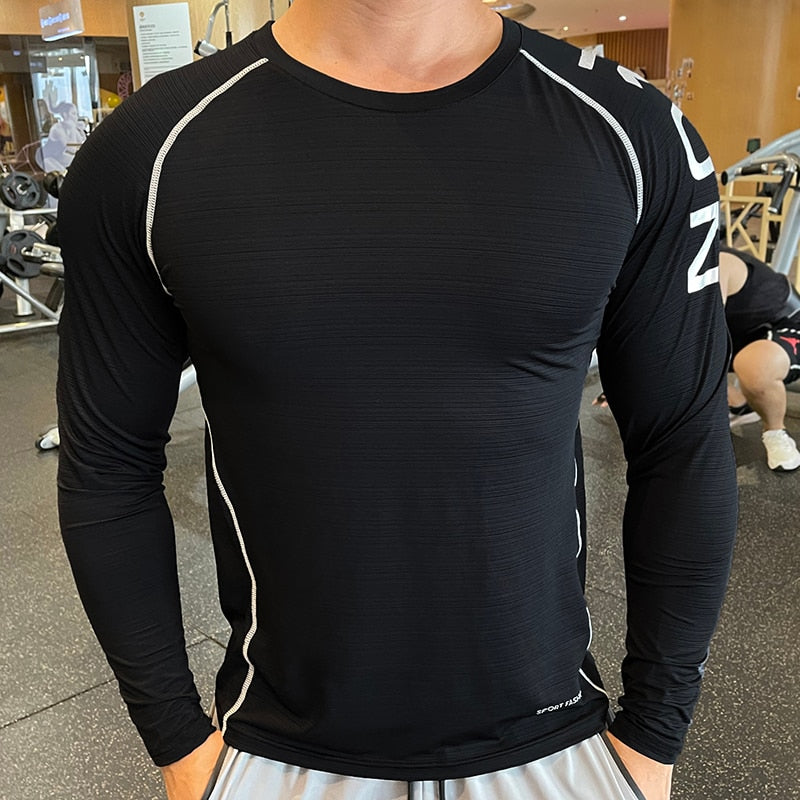 Men's Long Sleeve Gym Shirt, Sportswear Compression with Dry Fit Technology. Designed for Fitness and Sports, this Tight-Fitting T-Shirt keeps you Comfortable and Dry during Intense Workouts.