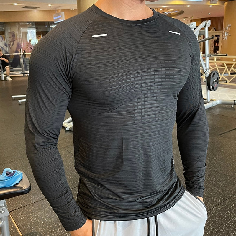 Men's Long Sleeve Gym Shirt, Sportswear Compression with Dry Fit Technology. Designed for Fitness and Sports, this Tight-Fitting T-Shirt keeps you Comfortable and Dry during Intense Workouts.