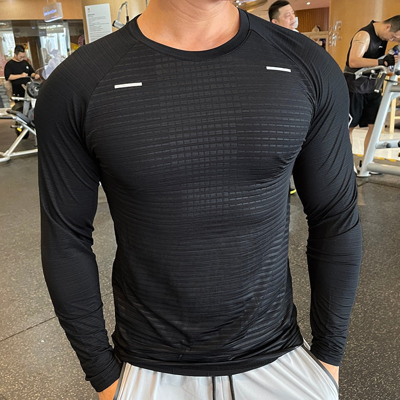 Men's Long Sleeve Gym Shirt, Sportswear Compression with Dry Fit Technology. Designed for Fitness and Sports, this Tight-Fitting T-Shirt keeps you Comfortable and Dry during Intense Workouts.