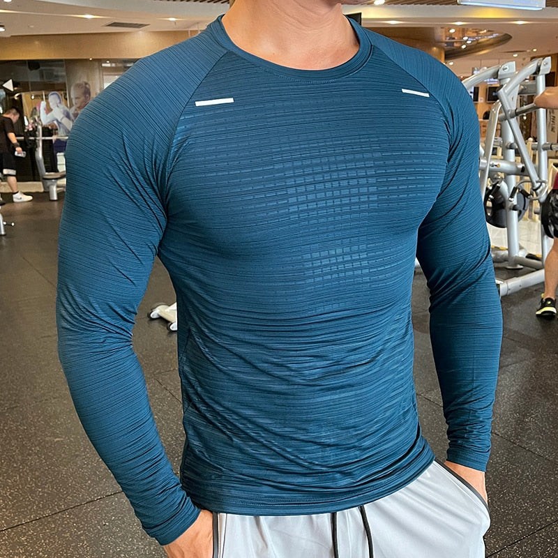 Men's Long Sleeve Gym Shirt, Sportswear Compression with Dry Fit Technology. Designed for Fitness and Sports, this Tight-Fitting T-Shirt keeps you Comfortable and Dry during Intense Workouts.